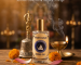 Sacred Ayoura Sky Bhakti Kusum astro fragrance offering inspired by Hanuman devotion with spiritual temple atmosphere, diya light, and grounded ritual energy.
